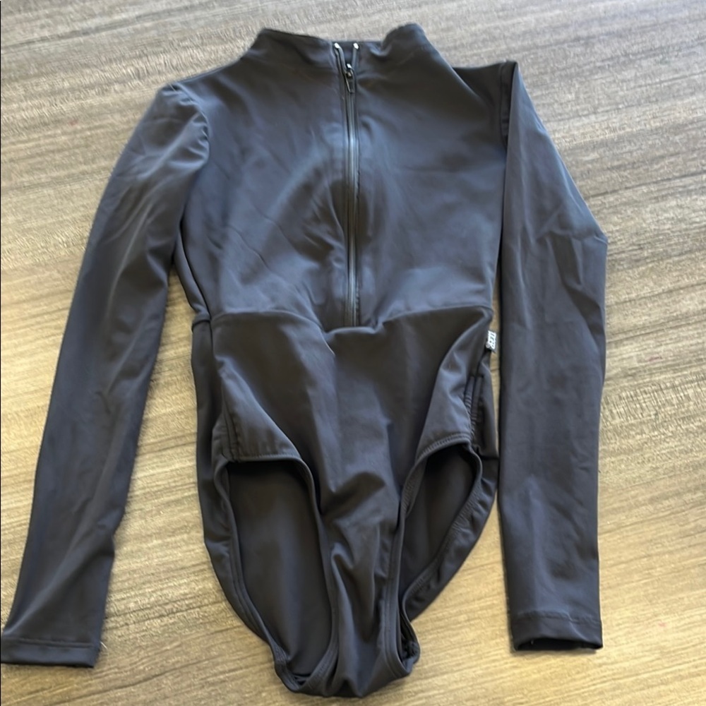 Tiger Friday Black Long 1/4 zip leotard. Size XXS